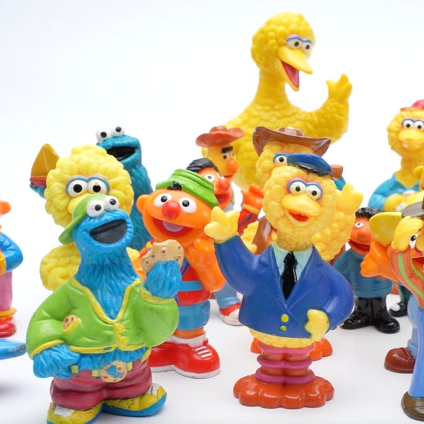 Sesame Street figures from different years and sizes (Sesame Street)