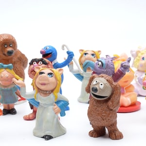 Vintage Muppets Figures from Various Years - Perfect for Collectors or Cake Toppers