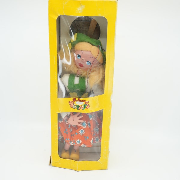 Vintage Pelham Puppet Girl with blonde hair and a skirt