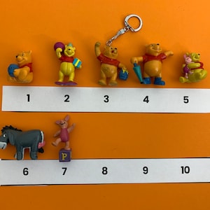 Figurki Kubusia Puchatka (zabytkowe i brelok)