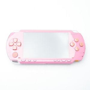 Consola portátil Sony PSP 1000 rosa en funcionamiento, color raro, PlayStation Portable