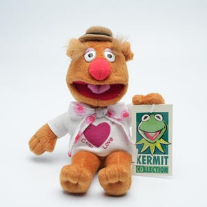 Bring Home the Beloved Muppet Characters with This Adorable Fozzie Bear Plush from the Exclusive Kermit Collection