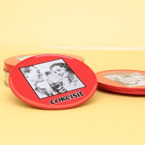 Vintage Coca Cola Set of 4 metal coasters in a storage tin, with text CokeItIs