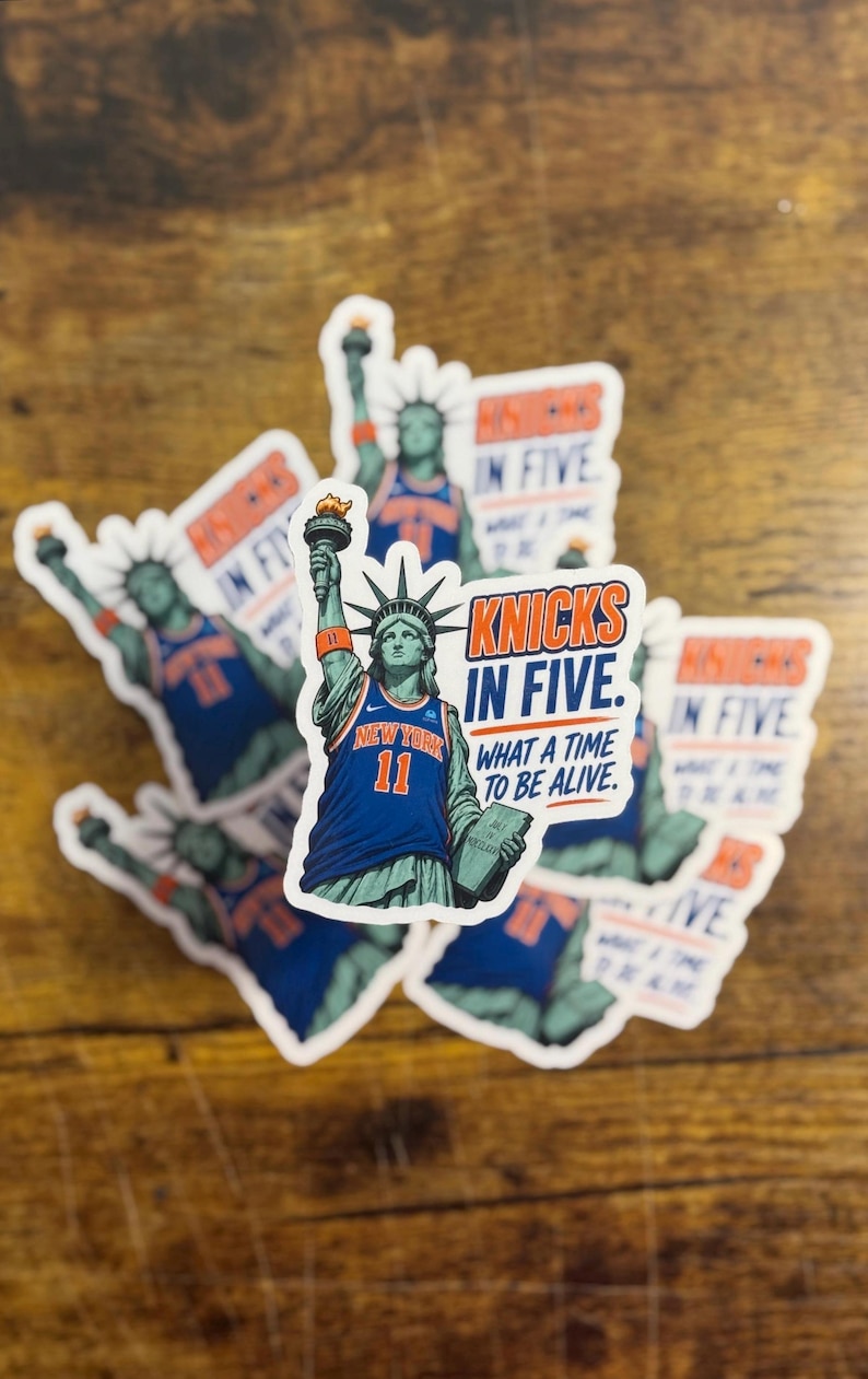 May include: A collection of die-cut stickers featuring the Statue of Liberty wearing a blue New York basketball jersey with the number 11. The text reads KNICKS IN FIVE. WHAT A TIME TO BE ALIVE. The statue holds a torch and a tablet.