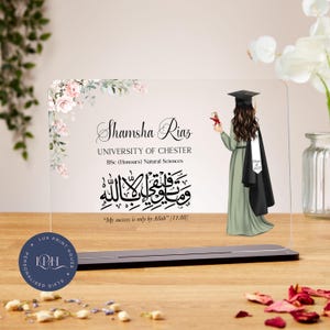 May include: A clear acrylic plaque with a floral design and a graduation cap silhouette. The plaque features the text "Shamsha Riaz", "University of Chester", "BSc (Honours) Natural Sciences", and an Arabic inscription. The inscription translates to "My success is only by Allah" [11:88].