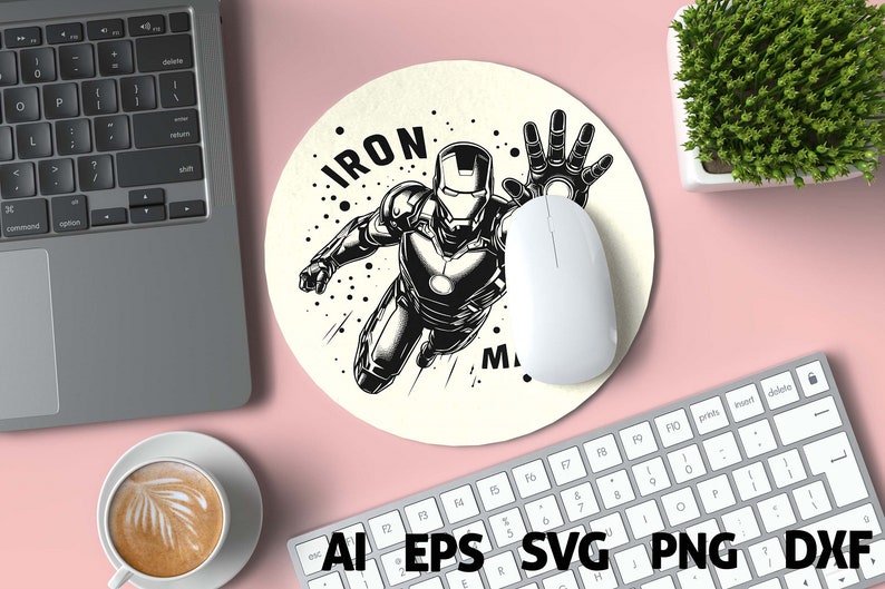 May include: Round beige mousepad featuring a black and white illustration of Iron Man in a dynamic pose, with the word "IRON MAN" in bold letters. A white computer mouse rests on the pad. The image is surrounded by a laptop, keyboard, and a cup of coffee.