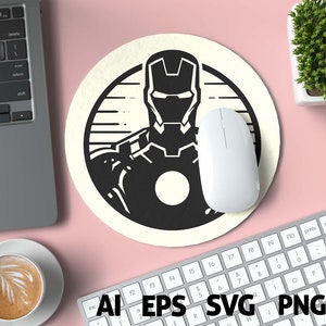May include: A round, off-white mousepad featuring a black and white illustration of Iron Man. A white computer mouse rests on the pad. The image also includes a laptop, keyboard, and a cup of coffee. The bottom of the image shows the file types: AI, EPS, SVG, PNG, and DXF.
