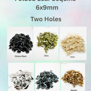 May include: Assortment of folded leaf sequins in six colors: glossy black, olive, ivory, silver, midnight, and metallic orange. Each sequin measures 6x9mm and has two holes.