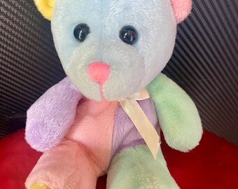 Super cute colourful little plushie. Rainbow colours. Plushie rescues. Soft toys. Teddy bears. Adoption. Adopt. Toy. Gifts. 90s PMS.