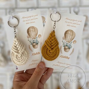 These keychains are custom made. The thread I use in the macrame keychain is 100% cotton. The knitting is done tightly and regularly. Thus, there is absolutely no opening or disintegration in the keychain.