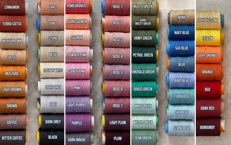May include: A collection of 48 spools of embroidery floss in various colors, including cinnamon, terra-cotta, milky brown, latte, mustard, light brown, brown, coffee, bitter coffee, tan 2, tan 1, stone, beige, creamy white, light grey, grey, dark grey, black, pomegranate, dark salmon, salmon, powder pink, candy pink, pink, light purple, purple, dark mauve, rose 1, rose 2, rose 3, rose 4, rose 5, rose 6, rose 7, light plum, plum, musty green, dark musty green, army green, petrol green, emerald green, grass green, mint green, water green, fern green, mink, light yellow, yellow, light orange, orange, red, dark red, burgundy, navy blue, sax blue, blue, baby blue, turquoise, sky blue, stone blue.