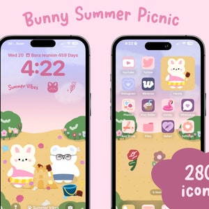 May include: Two phone screens with a summer picnic theme. The left screen shows a cartoon bunny building a sandcastle on a beach with another bunny watching. The right screen shows a grid of app icons with a cartoon bunny wearing a swimsuit and holding a beach umbrella.