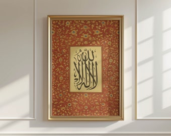 May include: A framed print of Islamic calligraphy in black ink on a cream background. The calligraphy is surrounded by a red and gold floral pattern. The frame is gold.