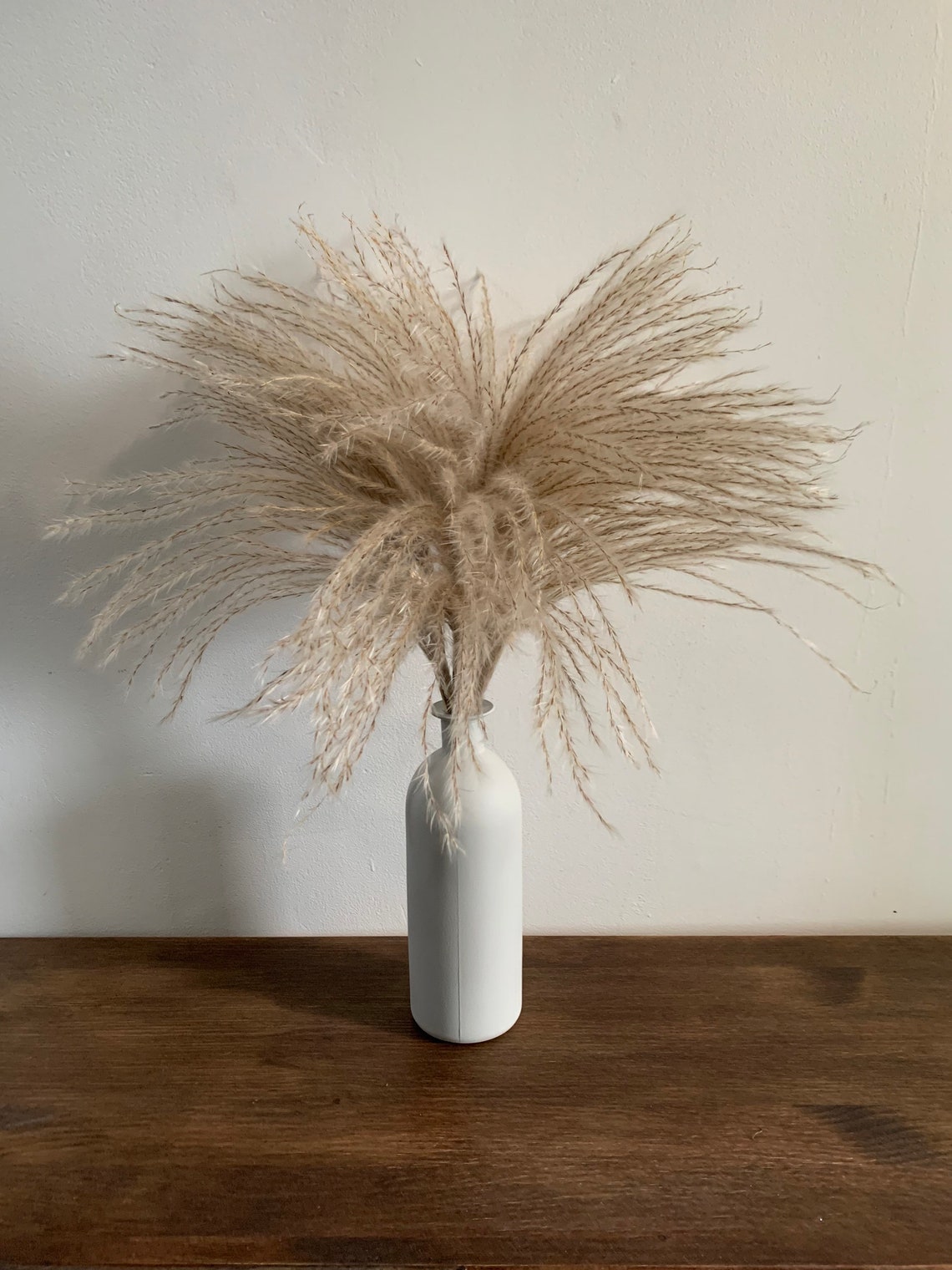 large black vase with pampas grass