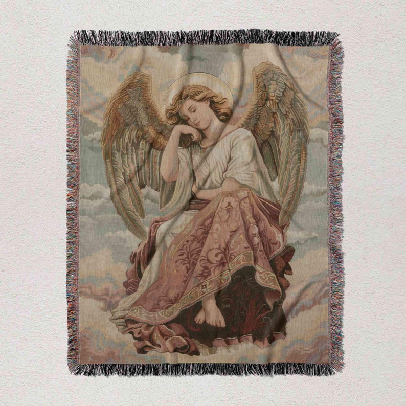 an angel with wings, sitting on a cloud and holding a book.