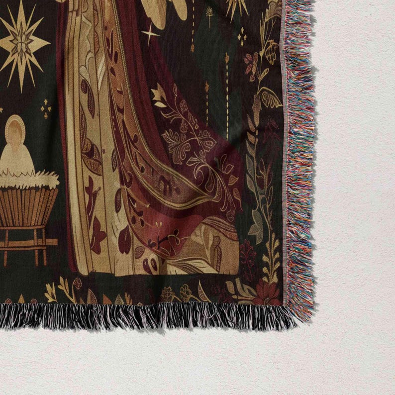 a close-up view of a decorative textile with a floral pattern and a star design. The textile has a fringe on the edges and appears to be a blanket or a throw.