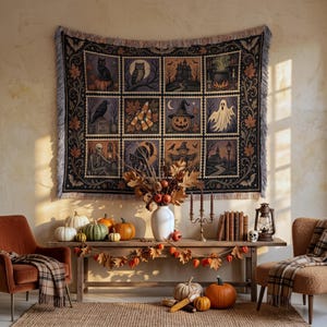 May include: A rectangular woven tapestry featuring a grid of twelve Halloween-themed illustrations including a black cat, owl, haunted house, cauldron, raven, candy corn, jack-o'-lantern, ghost, skeleton, black cat, scarecrow, and church.