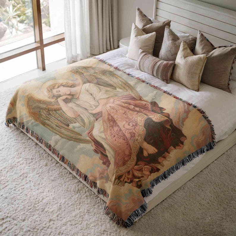 a large bed with a colorful, detailed tapestry or blanket featuring an angel-like figure on it. The bed is surrounded by pillows, creating a cozy and inviting atmosphere.