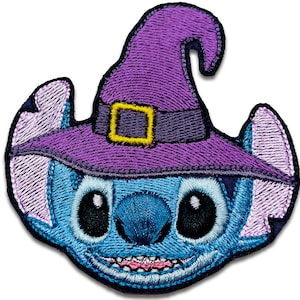 May include: A blue and purple embroidered patch of Stitch from Lilo & Stitch wearing a witch's hat.