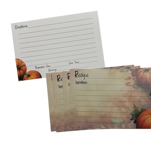 May include: Recipe cards with a fall theme. The cards feature a pumpkin and leaf design in the corners. The top card has the word "Directions" and lines for writing. The other cards have the word "Recipe" and "Ingredients" printed on them.