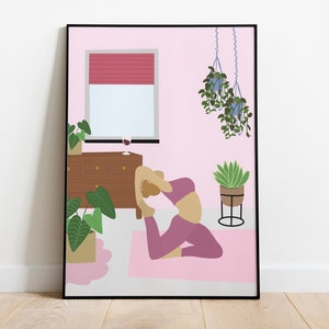 May include: A framed art print depicts a yoga scene in a pink room. A person is in the king pigeon pose on a pink mat. The room includes a window with a red blind, a wooden dresser, and hanging plants. A glass of wine sits on the dresser.