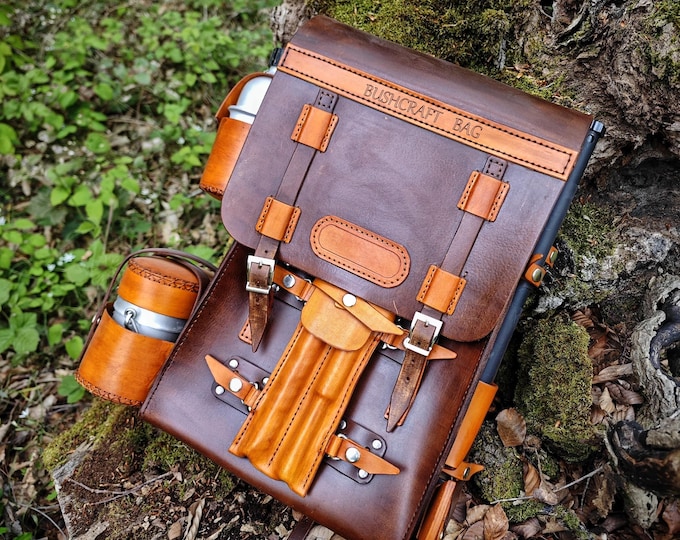 Survival bag bushcraft bag  a bushcraft axe,  handmade folding pan, aluminum water carrier,  camping pot, bushcraft drill, and bowsaw