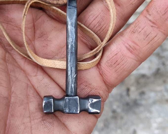 Handcrafted Steel Necklaces with Hammered Hammer Figures: Forging Hot Iron Using Traditional Techniques