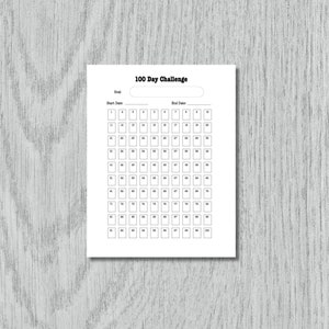 May include: A white 100 Day Challenge tracker sheet with the title at the top. The sheet includes spaces for a goal, start and end dates, and 100 numbered boxes. The text is in black.