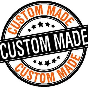 May include: Black and orange custom made stamp with a banner. The stamp has a circle with five stars and the text "CUSTOM MADE" around the outside.