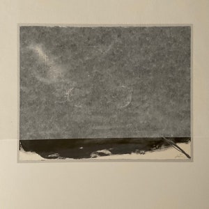 May include: A black and white abstract art print with a dark gray sky and a black horizontal line at the bottom.