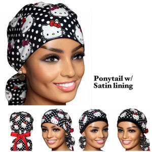 May include: A black scrub cap featuring a white polka dot pattern and Hello Kitty character graphics. The cap includes a ponytail pouch, a red ribbon tie, and the text Ponytail w/ Satin lining. The design is consistent across multiple views.