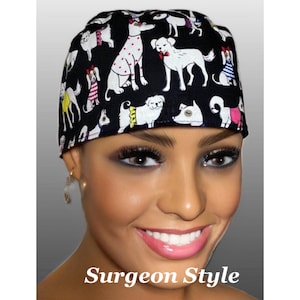 May include: Black surgical cap with a repeating pattern of white cartoon dogs in various poses, some wearing outfits. The text "Surgeon Style" is displayed in white at the bottom of the image. The cap is worn by a person.