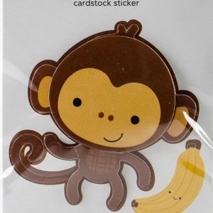 May include: A brown monkey cardstock sticker with a yellow banana. The sticker is part of the Doodle-Pops collection by Doodlebug Design Inc.