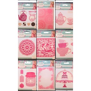 May include: A collection of pink paper cutouts and embossing folders with a vintage tea party theme. Designs include teapots, teacups, doilies, a ship, a jar, and a cake stand. Each package features the "Vintage Tea Party" logo.