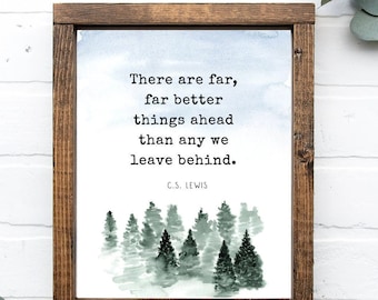 May include: A framed print with a watercolor illustration of a forest and a quote by C.S. Lewis: "There are far, far better things ahead than any we leave behind."
