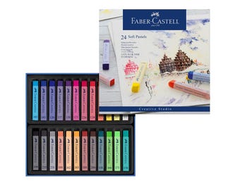 May include: A set of 24 soft pastels in a blue box. The pastels are arranged in two rows of 12. The box features the Faber-Castell logo and the text "24 Soft Pastels" on the front. The box also includes a picture of a watercolour painting of a building.