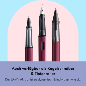 May include: Three pens in a burgundy colour with clear plastic barrels. The pens are a fountain pen, a rollerball pen, and a ballpoint pen. The text on the image reads "Auch verf&uuml;gbar als Kugelschreiber & Tintenroller Der LAMY AL-star ist so dynamisch & individuell wie du."