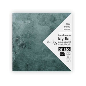 May include: A sketchbook with a teal stone cover. The cover has the text "real stone covers", "hand made lay flat professional sketchbook", "SM-LT art", "bristol", "308 g/m", "32", "Made in EU", and "Extra white".
