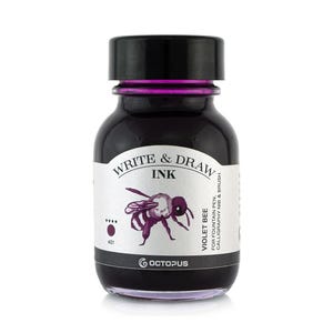 May include: A glass bottle of purple ink with a black cap. The bottle has a label that says "Write & Draw Ink" and "Violet Bee". The label also has a drawing of a bee.