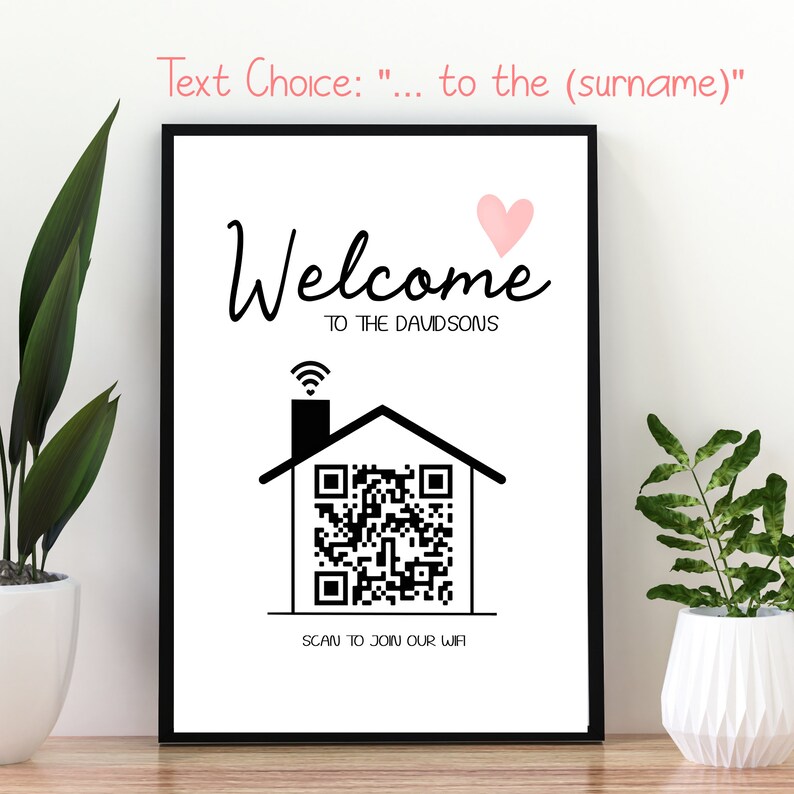 May include: A framed black and white sign with the word "Welcome" and a pink heart. Below, it reads "TO THE DAVIDSONS". A house graphic with a QR code and the text "SCAN TO JOIN OUR WIFI" is also featured.