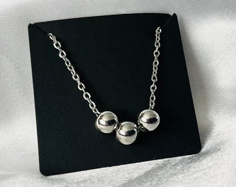 Stainless steel fidget necklace for stress and anxiety relief.