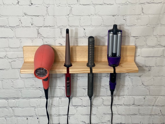 Wall holder for outlet hair dryers and straighteners
