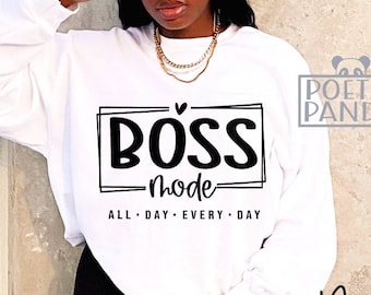 May include: A white sweatshirt with the text "BOSS mode" in a black rectangular frame. Below the text are the words "ALL DAY EVERY DAY". The sweatshirt is part of the Poetic Panda collection.