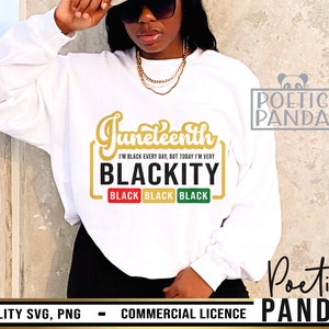 May include: White sweatshirt with a gold graphic that says "Juneteenth I'm Black Every Day, But Today I'm Very Blackity" with three black buttons that say "Black" in gold letters.