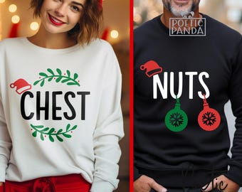 May include: Two Christmas-themed sweatshirts. One is white with the word "CHEST" surrounded by a wreath and a Santa hat. The other is black with the word "NUTS", a Santa hat, and two ornaments.