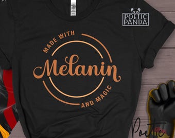 May include: Black t-shirt with a copper-colored circle design that says "Made with Melanin and Magic".