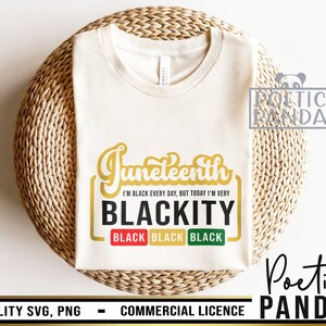 May include: A white t-shirt with a gold graphic that says "Juneteenth I'm Black Every Day, But Today I'm Very Blackity" with the word "Black" repeated three times in a smaller font below. The graphic is surrounded by a black rectangle.