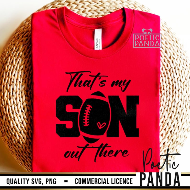May include: Red t-shirt with black text that reads "That's my SON out there" with a football graphic in the middle of the word "SON".