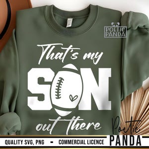 May include: Green sweatshirt with white text that reads "That's my SON out there" and a white football graphic. The text "POETIC PANDA" is also visible in the image.