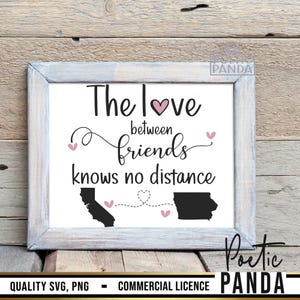 May include: A white framed print with the text "The love between friends knows no distance". The print features two states, California and Illinois, connected by a dotted line with hearts.